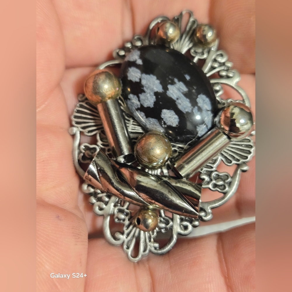 Elegant Silver and Black Brooch